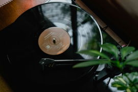 black turntable on brown wooden table